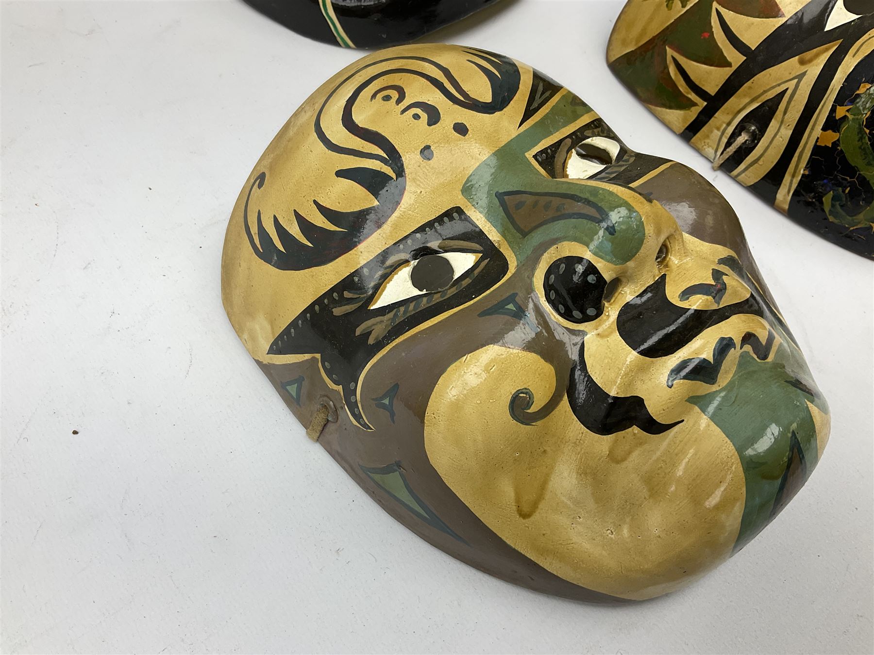 Five Japanese theatre / opera masks, the papier-mâché traditionally painted in the Noh Kabuki style, L18cm