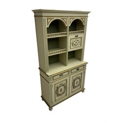 Portuguese painted dresser, two-tier plate rack with spindle gallery and fall-front cupboard, flanked by fluted uprights, fitted with two drawers over two cupboards, the panelled cupboards with floral decoration and a rinceaux border, white painted and parcel-gilt 