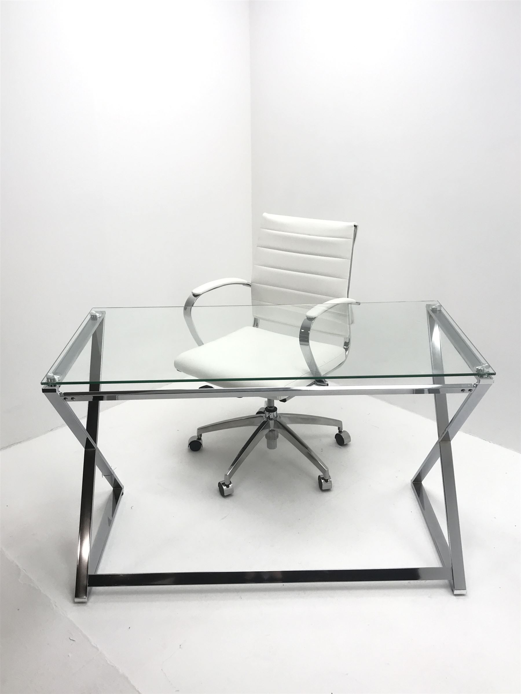 Chrome 'X' framed desk with rectangular glass top (W121cm, H75cm, D60cm) and matching chrome and faux leather swivel chair (W58cm)