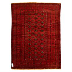 Turkman hand-knotted carpet, deep red ground, with an all-over field of repeating gul moti...