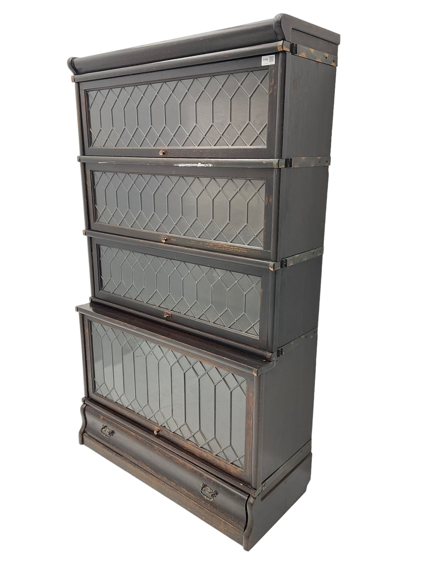 Globe Wernicke - early 20th century oak stacking library bookcase, enclosed by four lead glazed doors, fitted with single drawer