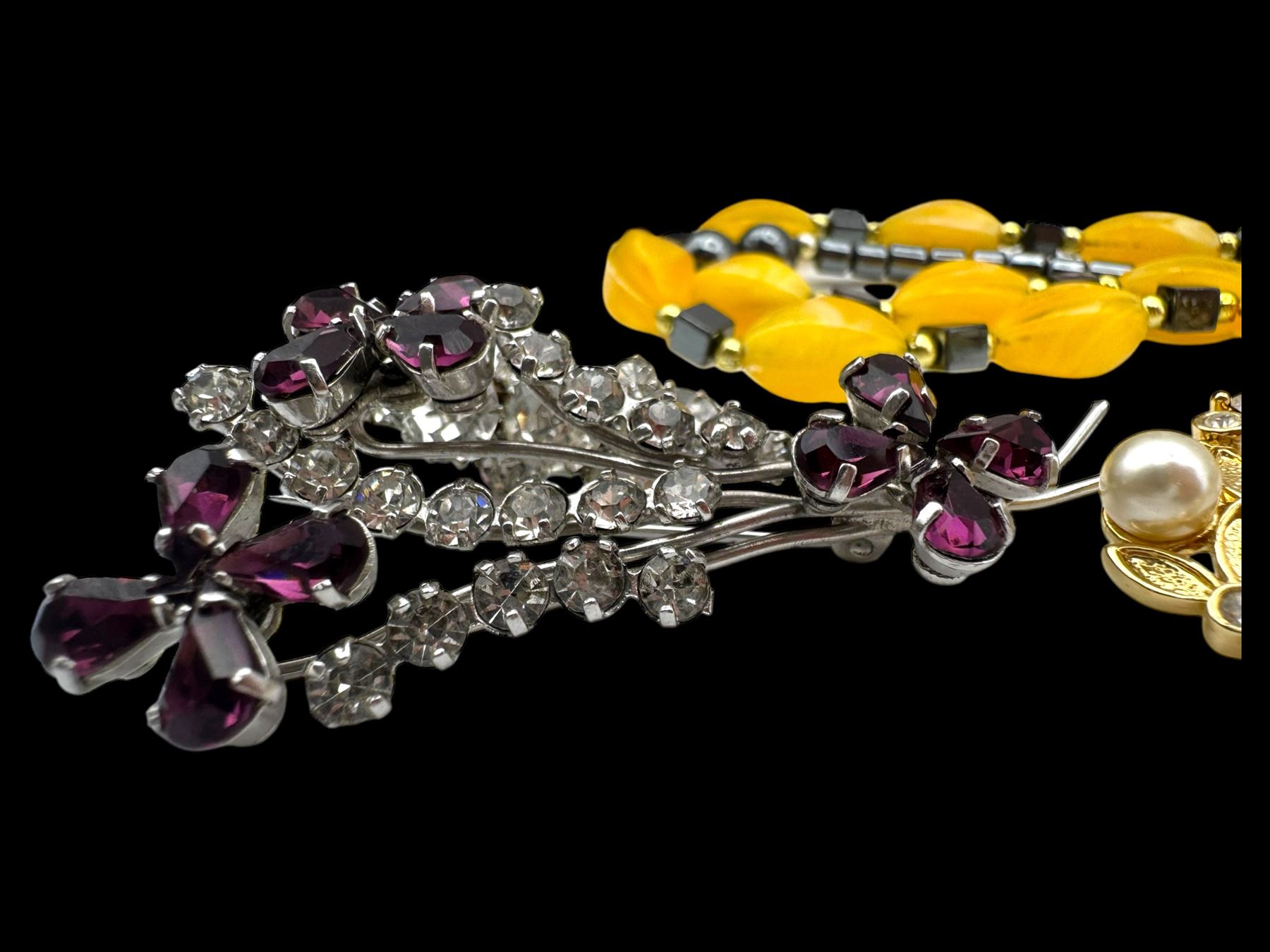 Four pairs of 9ct gold stud earrings, silver stone set stud earrings and a collection of costume jewellery brooches and bead necklaces