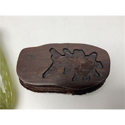 Carved jade figure of a phoenix perched on a flowering branch, upon a wooden stand, with original box, H27cm