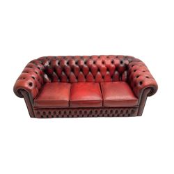 Three seat Chesterfield sofa, upholstered in deeply buttoned red leather