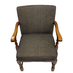 Mid to late 20th century medium oak framed open armchair, upholstered loose seat cushion and back in dotted fabric, on turned supports