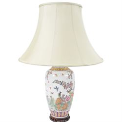 Chinese famille rose table lamp, of baluster form, decorated with birds in blossoming branches, upon a circular wooden base with shade, H78cm