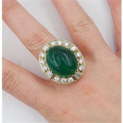 Gold emerald and diamond ring, the central oval cabochon emerald, with sixteen round and rectangular cut diamond halo surround by Judith Crowe, hallmarked 9ct, emerald 20.00 carat, total diamond weight 2.00 carat, with World Gemological Institute report