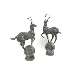 Pair cast metal garden stags on spherical mounts, figures/gate post finials, 