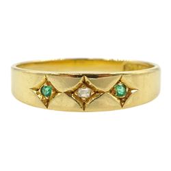 Early 20th century gold three stone gypsy set emerald and diamond ring, stamped 18ct 