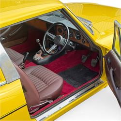 1973 Triumph Stag Mk II 3.0 V8 Manual with Overdrive

Registration: FTV 859L
Date of first registration: 8th March 1973
Recorded mileage: approximately 50,000 miles
Engine: 2,997cc petrol V8
Transmission: four-speed manual with overdrive

An attractive manual-overdrive example of Triumph’s celebrated V8 grand tourer, finished in yellow and supplied with both a removable hardtop and folding soft top.

The car has been the subject of extensive restoration and mechanical work, supported by a large history file containing invoices, notes and photographs documenting the work undertaken. The accompanying records indicate that the engine was rebuilt at approximately 36,000 miles, including re-boring of the block, checking and machining of the top faces, and steam cleaning following machining.

Further work and replacement parts are understood to include an upgraded radiator, electric cooling fan, Stag Webber header tank kit, complete set of cooling hoses and clips, fuel pump and filters, alternator, distributor cap, HT leads, spark plugs, front brake calipers and hoses, rear brake cylinders, tyres, front lights and LED bulbs. Various seals, interior trim items and seat components have also reportedly been renewed.

The car is believed to have been dry-stored from 1994 until 2017, with a substantial programme of recommissioning and improvement subsequently undertaken between 2017 and 2023. The history file also includes earlier MOT certificates dating from 1988 to 1994.

Offered with its V5C, hardtop, soft top, extensive restoration and maintenance history, photographic record and a quantity of useful spare parts, including a new dashboard veneer set.