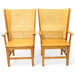 Pair of 20th century full-size pine Orkney chairs, high-back armchairs of traditional design, pegged and wedged construction, wrap-around backrest and sides, above scrolled out-swept arms and solid rounded pine seat, raised on square tapering legs united by stretchers, hand-signed ‘Jackie Miller’ and stamped ‘Orkney’
