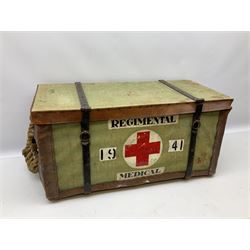 WW2 British Army RAMC 'Regimental Medical Pannier', well marked externally and dated 1941, stamped May 1943 internally, canvas covered wicker form with leather edges, hinged top and fall front with two rope carrying handles, fitted iron locking straps with securing chains; contains various unused field dressings and bandages with WW2 dates and two pillows; original label under lid L79cm