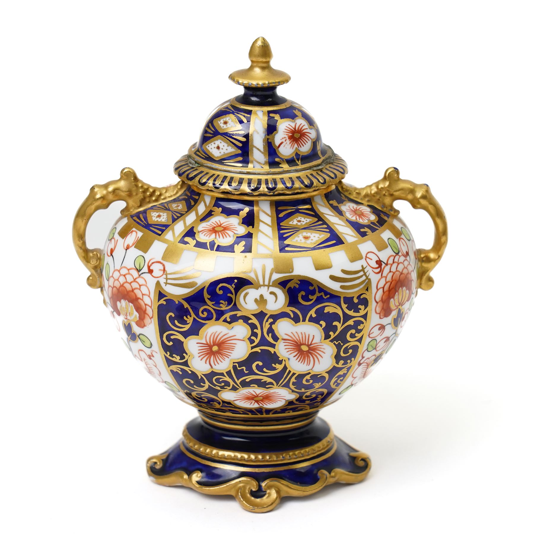 Mixed Royal Crown Derby Imari 6299 pattern wares, including a pair of vases, H8cm; covered twin handled urn, H14cm; slender vase, H19cm, and a pattern 2451 plate, D23cm (5)