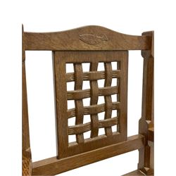 Fishman - oak child's rocking chair, carved and pierced lattice back, the cresting rail carved with fish signature, by Derek Slater, Crayke (before becoming Lizardman)