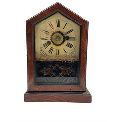 An American spring driven 30-hour 19th century timepiece shelf clock in a wooden case with a gable top and finial, decorative glass door with a white painted dial, roman numerals and minute track, with steel spade hands. No pendulum or key.
H33 W20 D12
With a similar design of spring driven 30-hour 19th century American shelf clock with an alarm, white painted dial with Roman numerals and minute track, steel spade hands with brass alarm setting disc to the centre.
With pendulum and key.
H24 W18 D9
