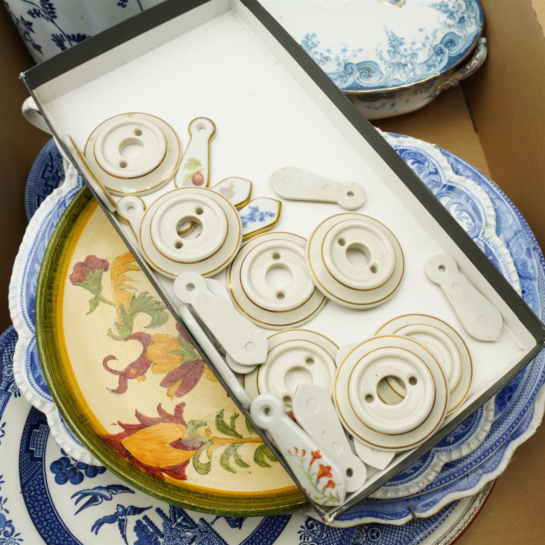 Early 19th century Rogers blue and white platter, other blue and white plates, ceramic door furniture, Palissy Game series bowls, folk art plates etc in two boxes
