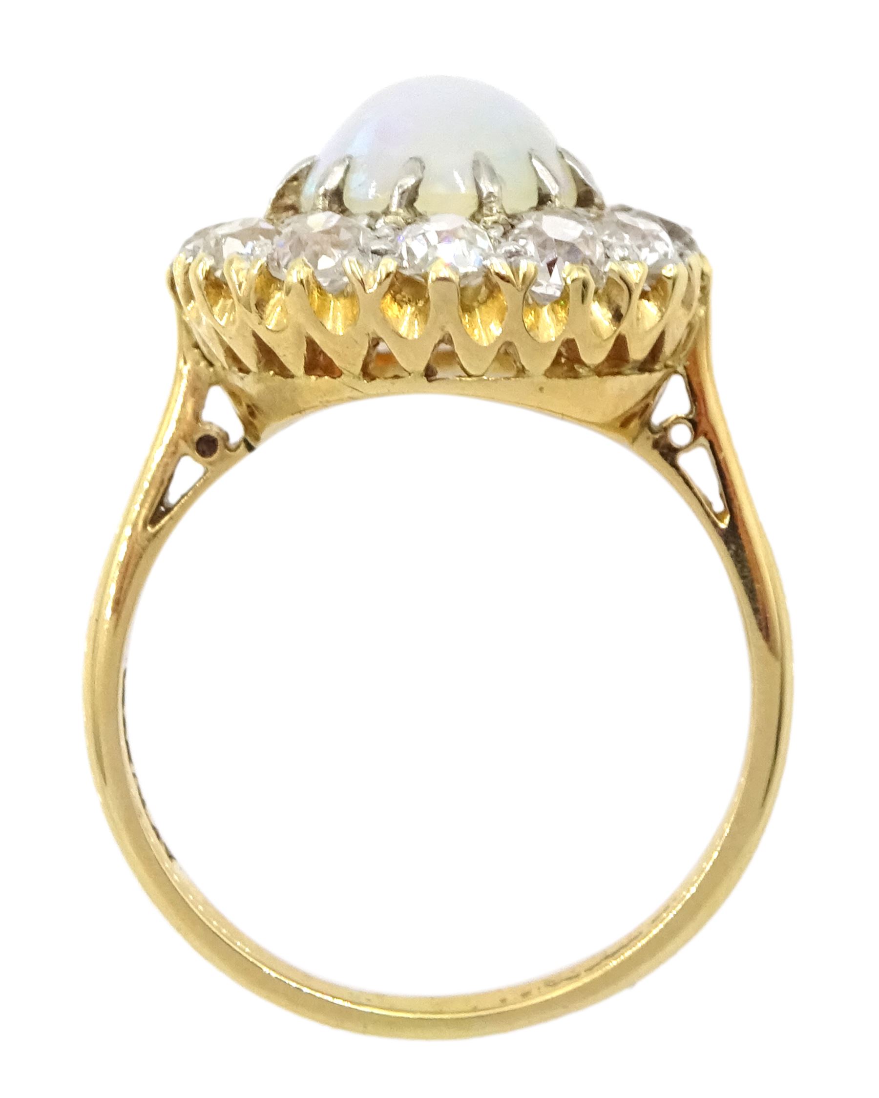 Early 20th century opal and old cut diamond cluster ring, stamped 18ct Plat, total diamond weight approx 1.00 carat