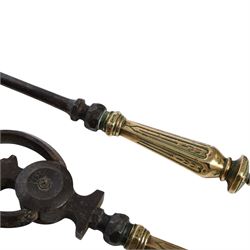 Set of three 19th century brass and steel fire irons, each with tapering and hexagonal capped handles, comprising poker, tongs and shovel with pierced detail, poker L84cm