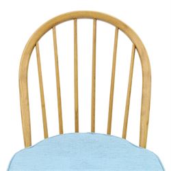 Ercol - pair of 'Windsor' dining chairs, with high hooped back, blue seat cushions with studded, tapered supports  
