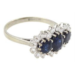 18ct white gold three stone oval and round cut sapphire and round brilliant cut diamond cluster ring, London 1986, total sapphire weight approx 1.80 carat, total diamond weight approx 0.60 carat