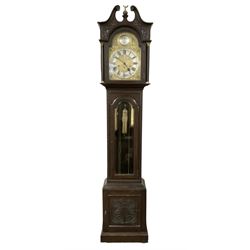 German - 8-day oak longcase clock c1910, with a carved case, swan necked pediment and fully glazed trunk door, brass dial with a silvered chapter ring with Roman numerals, minute track and silvered 