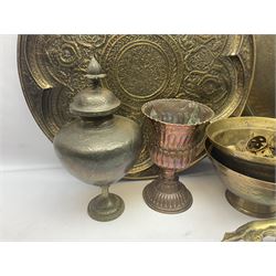 Collection of oriental brass and other metal ware, to include to large chargers, pair of covered urns, hoho bird, etc, largest charger D63cm