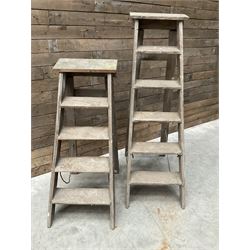 Two antique wooden step ladders, H100cm and 140cm