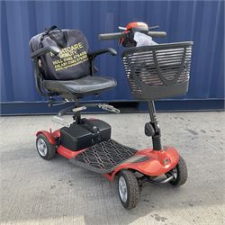 Four wheel electric mobility scooter in orange with keys and charger  - THIS LOT IS TO BE COLLECTED BY APPOINTMENT FROM DUGGLEBY STORAGE, GREAT HILL, EASTFIELD, SCARBOROUGH, YO11 3TX