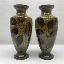 Pair of Royal Doulton Stoneware Vases with leaf decoration, by Ethel Beard, impressed marks to base numbered 6768 and 8222 and initials EB, H32cm