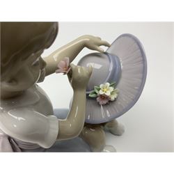 Three Lladro figures, comprising Playful Romp no. 5594, Bashful Bather no. 5455 and Elegant Touch no. 6862, largest H15cm