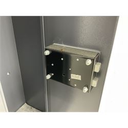 Grey steel wall mounting gun cabinet to accommodate three guns; single door with two locks with two keys for one lock; internally H128.5cm W21cm D17.5cm; externally H129cm W21.5cm D20cm