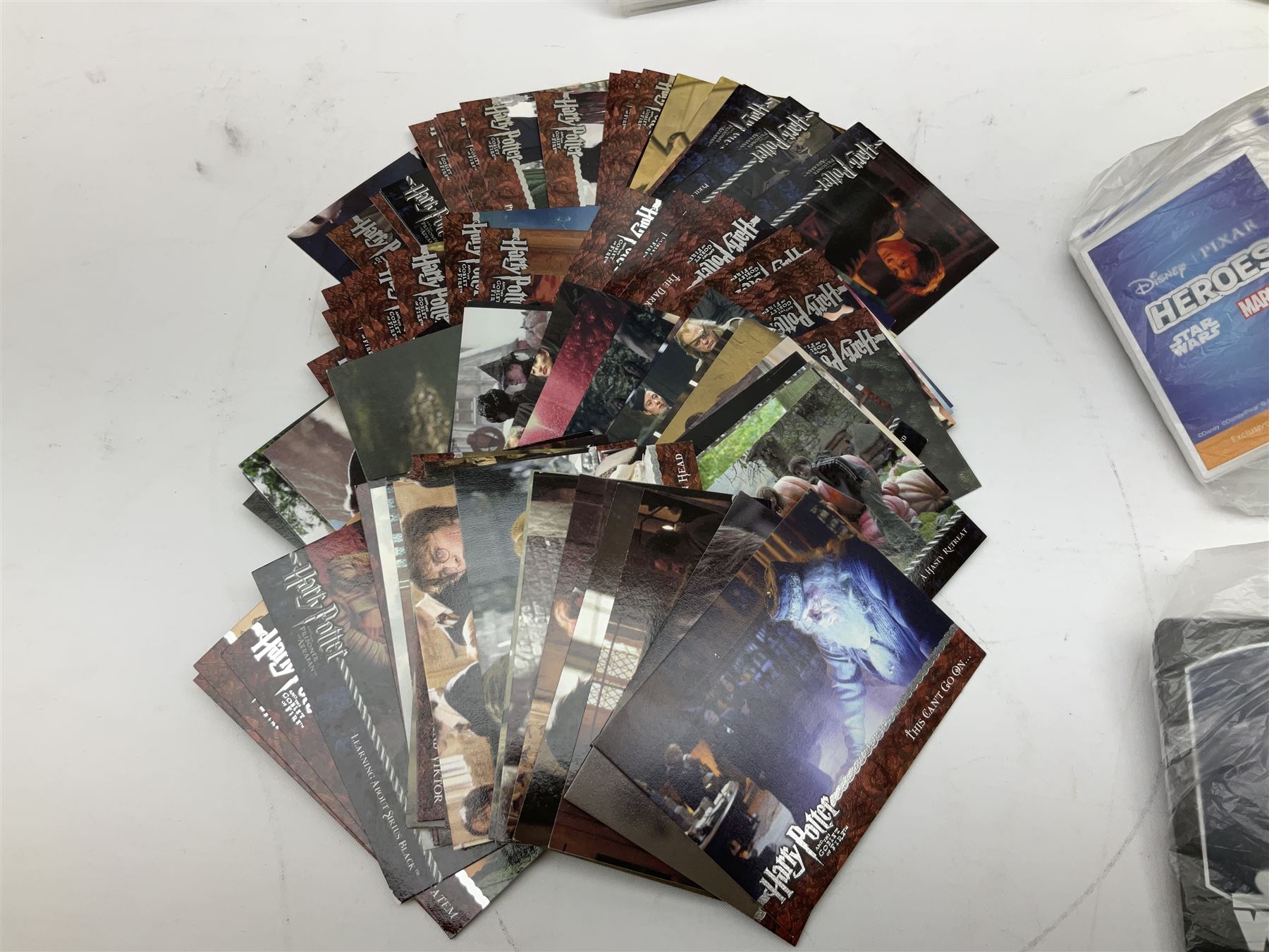 Collection of Star Trek collectors cards to include ‘Alternate Universe’ and ‘Q Continuum’ series, Star Wars cards etc housed in white album
and Harry Potter, Disney and other loose examples