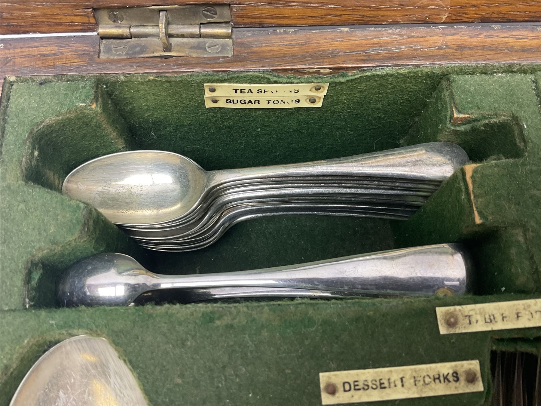 Walker and Hall silver plated canteen of cutlery, oak case, the hinged lid with a engraved brass shield , H12cm, L32cm