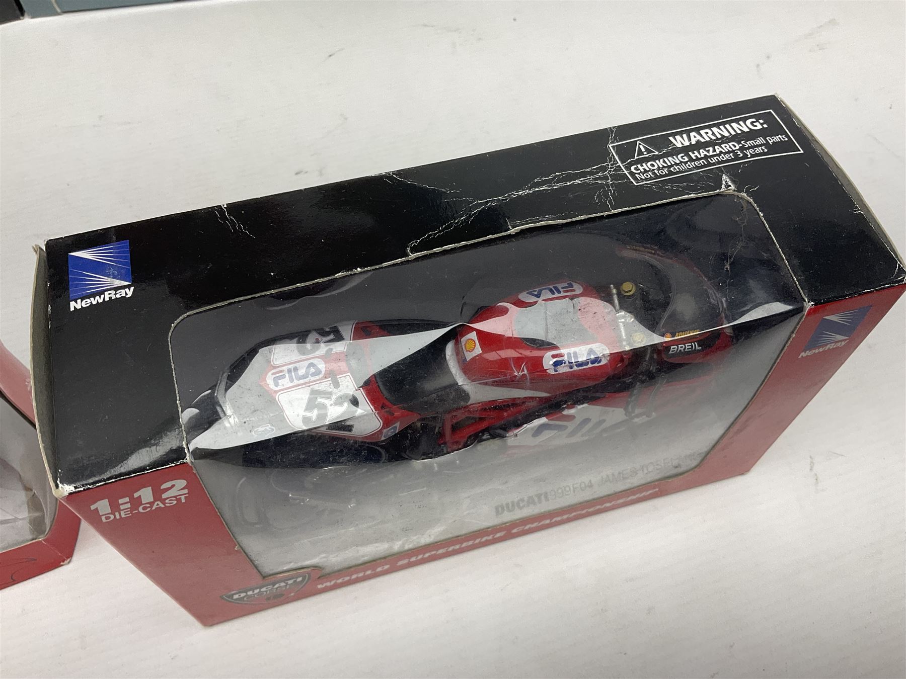 Nine NewRay 1:12 scale die-cast models of motorcycles including Ducati, Honda etc; and four other 1:12 scale die-cast models of motorcycles; all boxed (13)