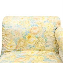 Victorian chaise longue in chintz upholstery, scrolled back with turned spindles up, raised on castors