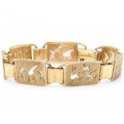 Gold seven panel bracelet, each with pierced design hunting scene decoration, stamped 9ct