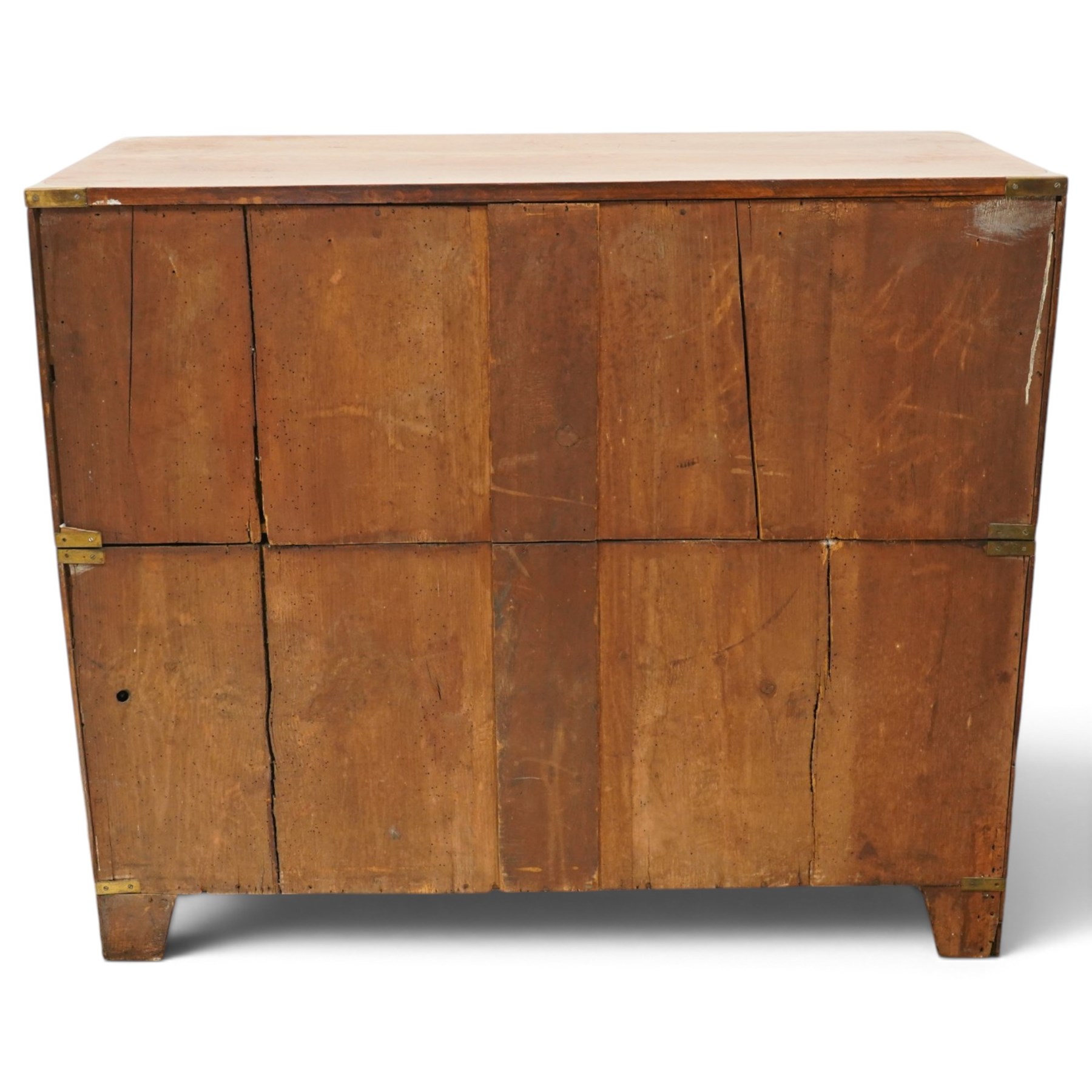 19th century figured mahogany military campaign chest of drawers in two sections, the rectangular top with brass-bound corners over two short and three long graduated drawers, each fitted with recessed brass campaign handles and escutcheons, the carcass with brass strapwork and carrying handles to the sides, raised on short bracket feet