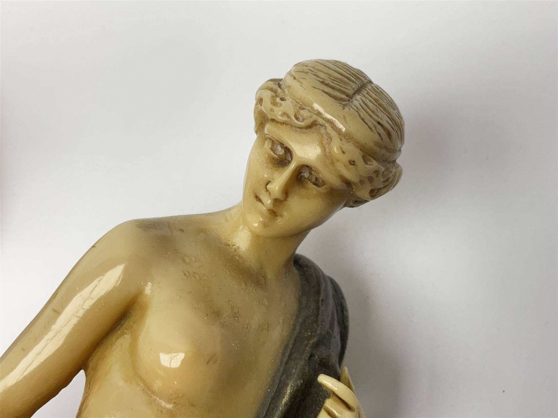 After Ferdinand Preiss (1882-1943), pair of Art Deco style, composite semi nude classical female figures, raised on circular onyx bases, H21cm