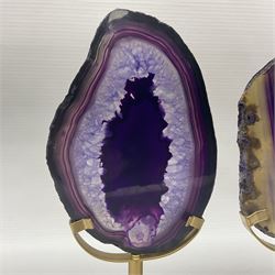 Pair of purple agate slices, polished with rough edges raised upon gilt metal stands