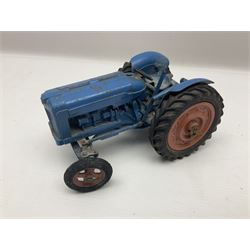 Chad Valley - two unboxed and playworn large scale Fordson tractors - No.9235 Fordson Major Tractor, dark blue diecast body, orange wheels, crank handle clockwork mechanism and 'Firestone' rubber tyres; and No.M59 New Fordson Major Tractor, blue diecast body, tinplate hinged bonnet, orange wheels and clockwork motor contained in rear wheel hub (2)