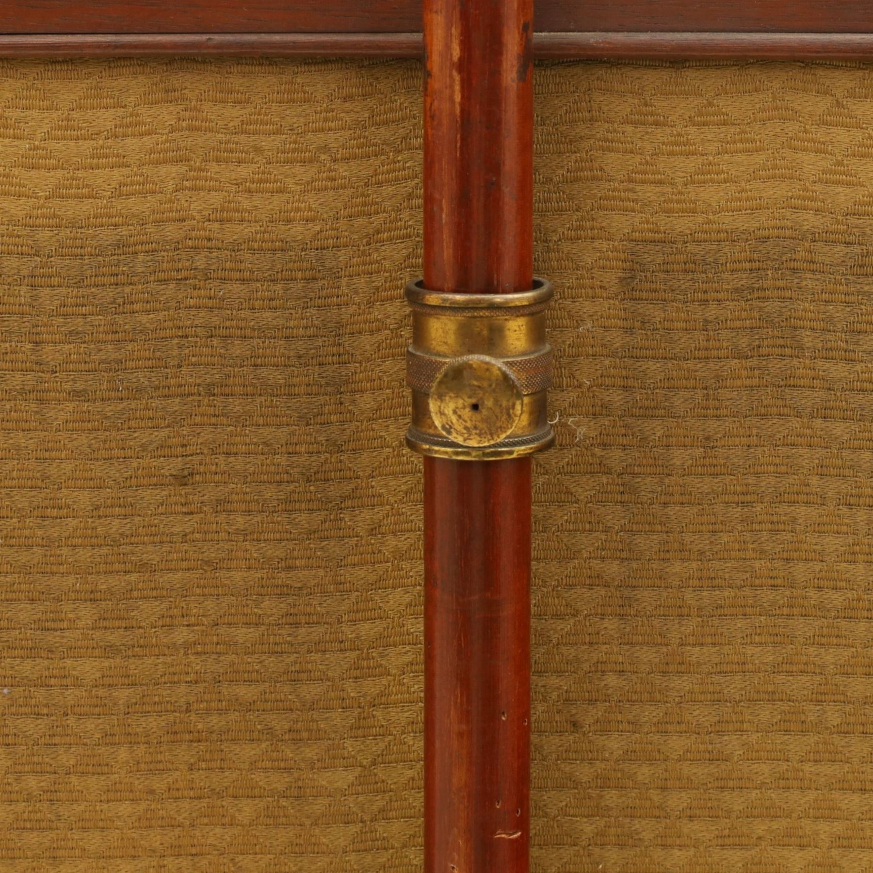 Two Victorian fire screens, comprising mahogany pole screen with glazed floral woolwork panel on turned support and triform base (H 142cm, W 48cm); and a larger carved walnut tapestry fire screen, glazed panel depicting a domestic interior scene, scroll carved cresting, barley twist uprights and turned stretcher base (H 75cm, W 49cm)