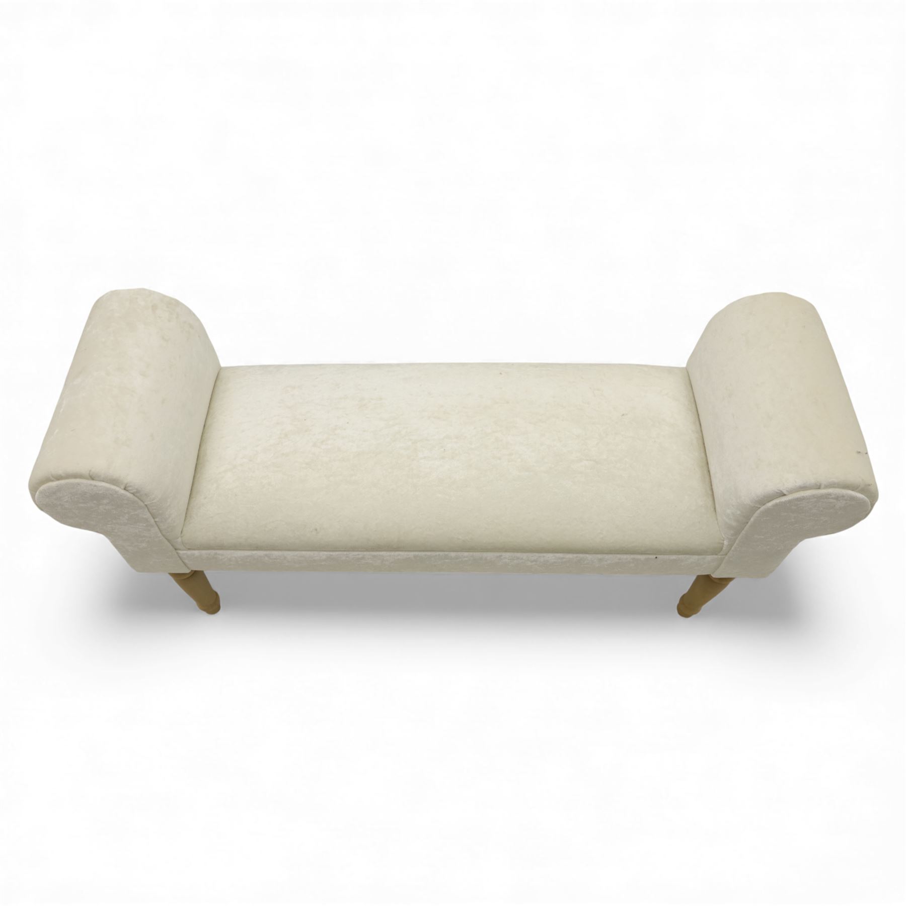 Contemporary upholstered window seat, rectangular padded seat with shallow scroll ends, upholstered in light cream fabric, raised on four turned wooden supports