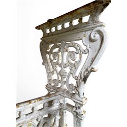 Victorian cast iron garden table, rectangular slate top raised on pierced scrolling foliate end supports with urn and column designs, united by a spindle support stretcher with scrolling acanthus spandrels, stamped 'Registered Design' with indistinct number, in distressed white painted finish