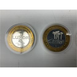 Eight Las Vegas limited edition ten dollar casino silver strike gaming tokens, consisting of a fine silver centre with brass outer ring (8)