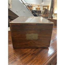  Victorian brass inlaid rosewood dressing table box, retailed by F.L. Hausburg, Liverpool, the lid centred by a brass cartouche, opening to reveal letter store to lid underside, above a fitted interior, with ten mounted cut glass jars, bottles and manicure set, within lift out leather trays, above jewellery drawer, with key, H17cm D24cm
