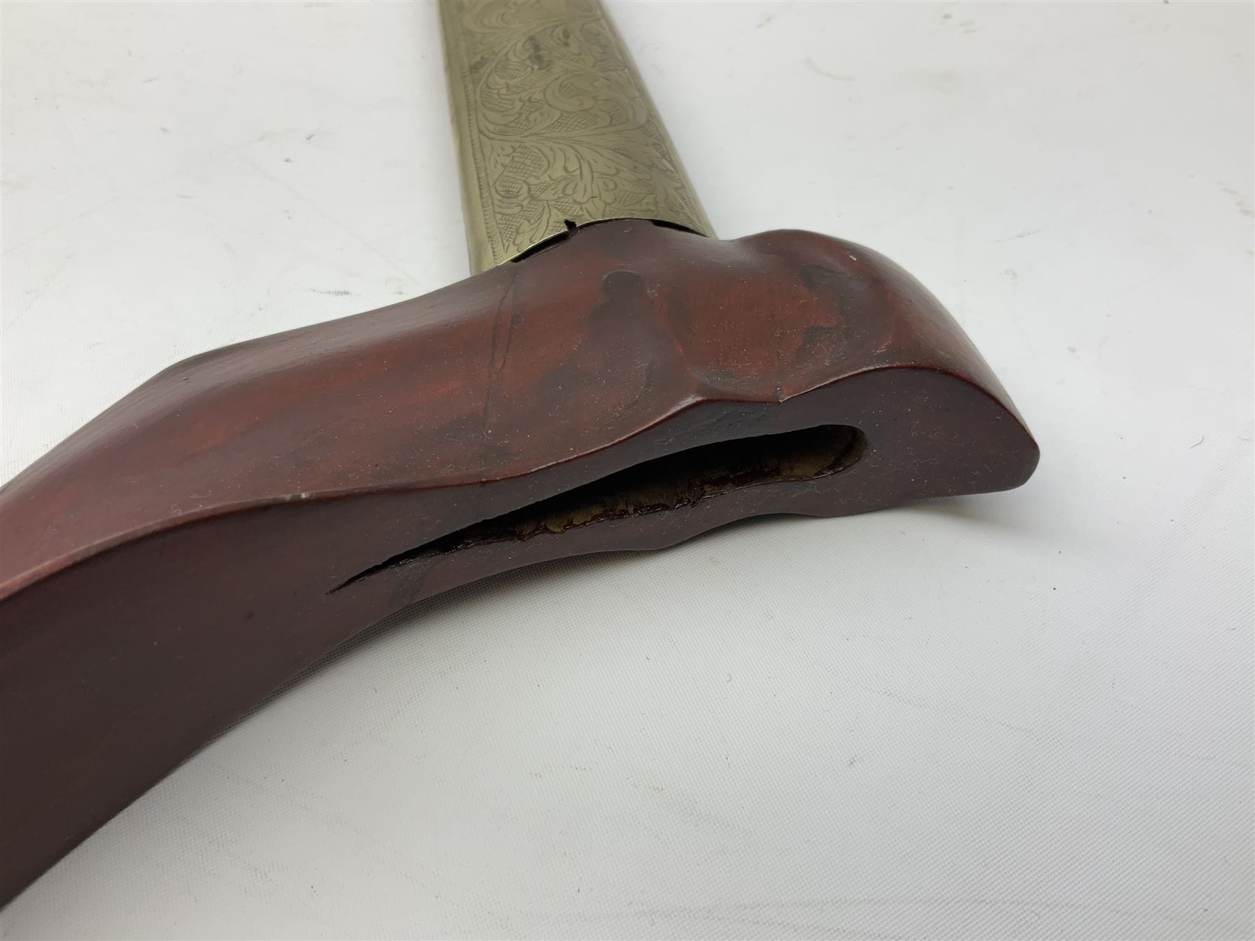 Malayan Kris dagger, the 31.5cm double edged straight heavy damascus blade with copper ferrule; carved hardwood grip; in large wooden throated scabbard with floral decorated white metal covering L47.5cm overall; a kris blade with adapted antler grip; and five various small daggers/letter openers (7)