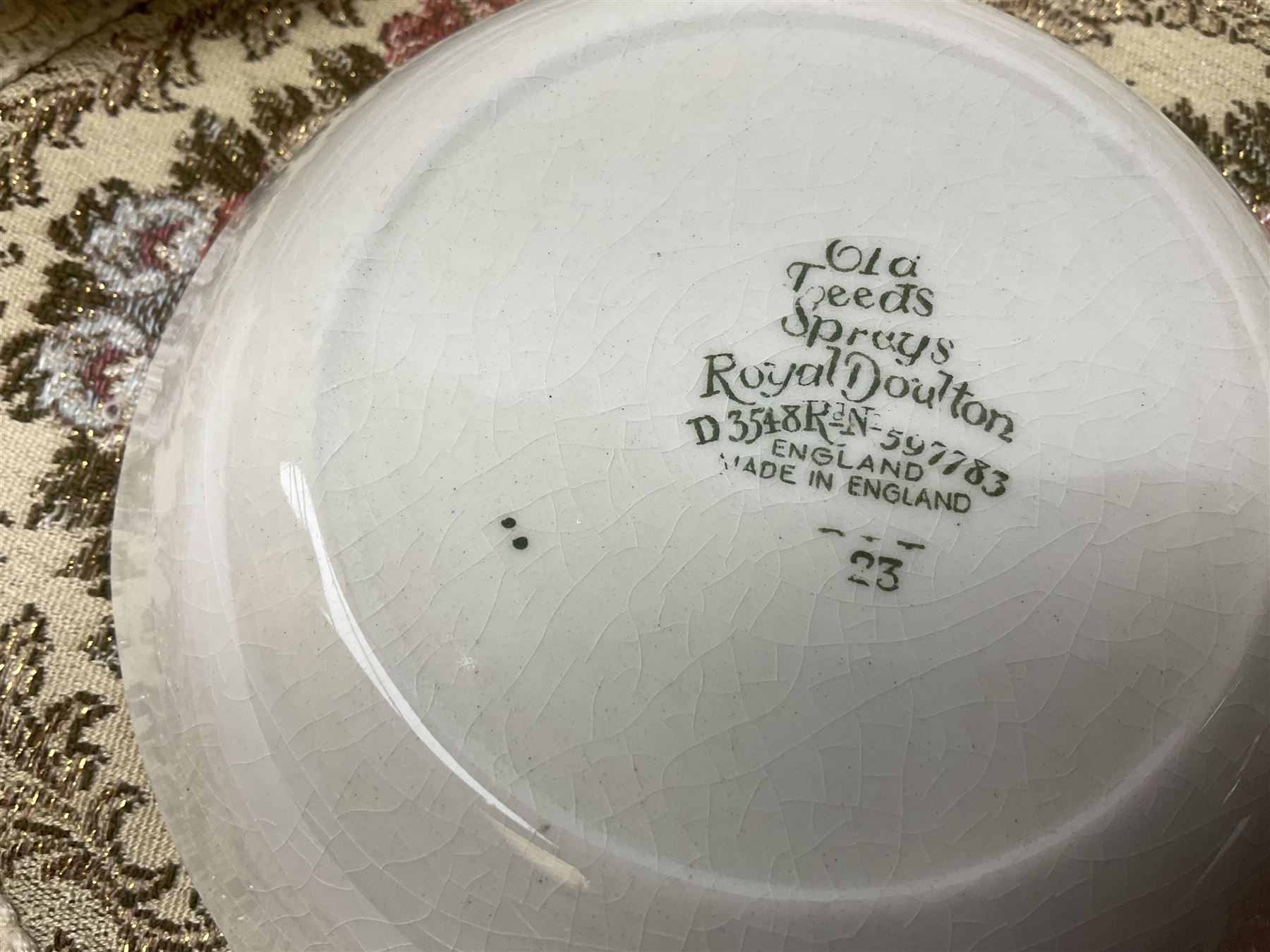 Royal Doulton part dinner service in Old Leeds Sprays pattern,  to include cheese dome, teapot and stand, egg cups etc, together with a selection of floral doilies.  