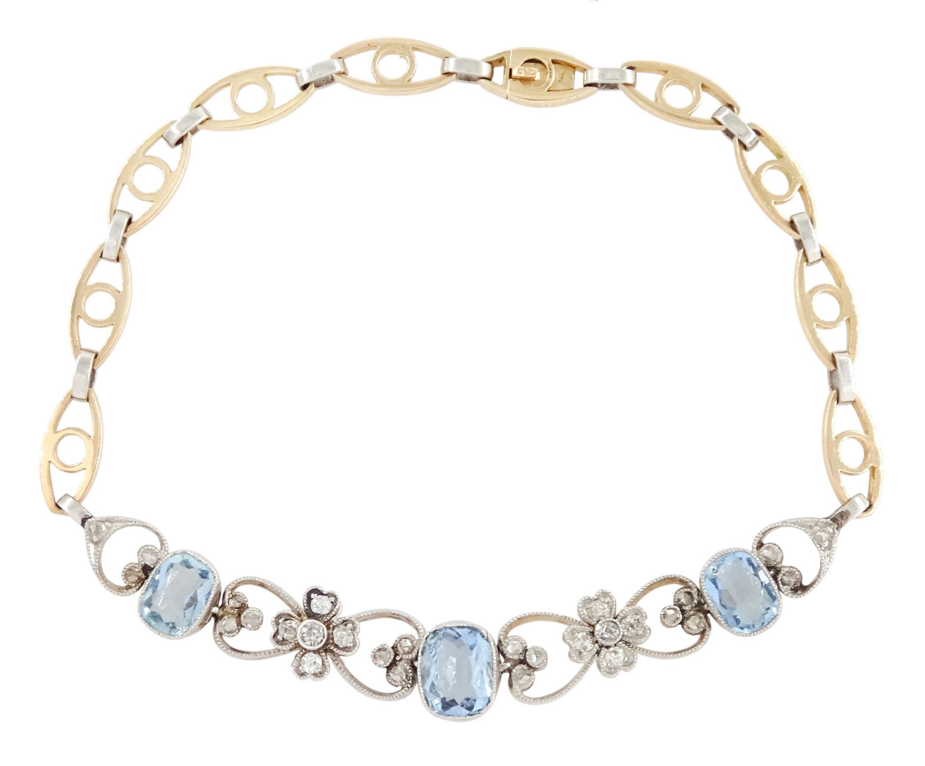 Early 20th century gold and platinum aquamarine and diamond bracelet, three cushion cut aquamarines, each spaced by milgrain set diamond heart and flower head links, to a fancy gold and platinum openwork link bracelet