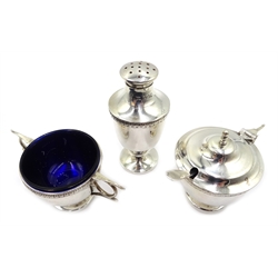  Five piece condiment set, silver-gilt interiors with three spoons and blue glass liners by Walker & Hall, Sheffield 1917, approx 11oz, cased  