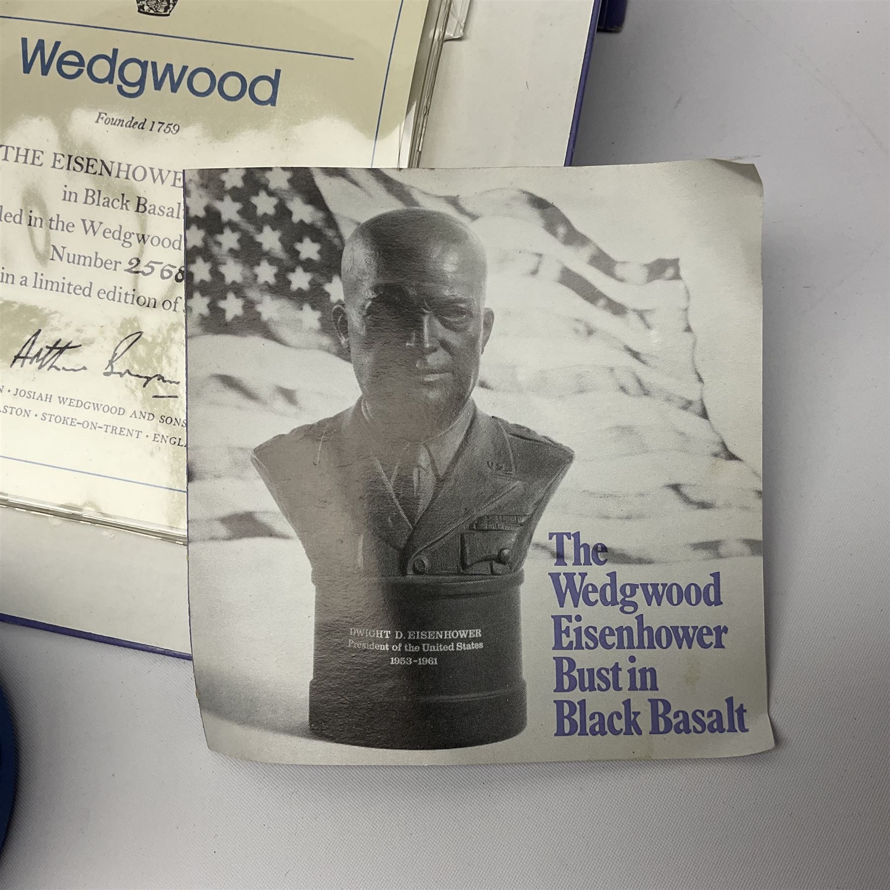 Collection of Wedgwood Jasperware, to include black Eisenhower Bust, two black basalt paperweights, one depicting an eagle and one depicting Julius Caesar, a blue Zodiac plate, Man on the Moon commemorative plate, American Independence Bicentennial plate and Royal commemorative ware, etc, all with impressed marks beneath, some with boxes